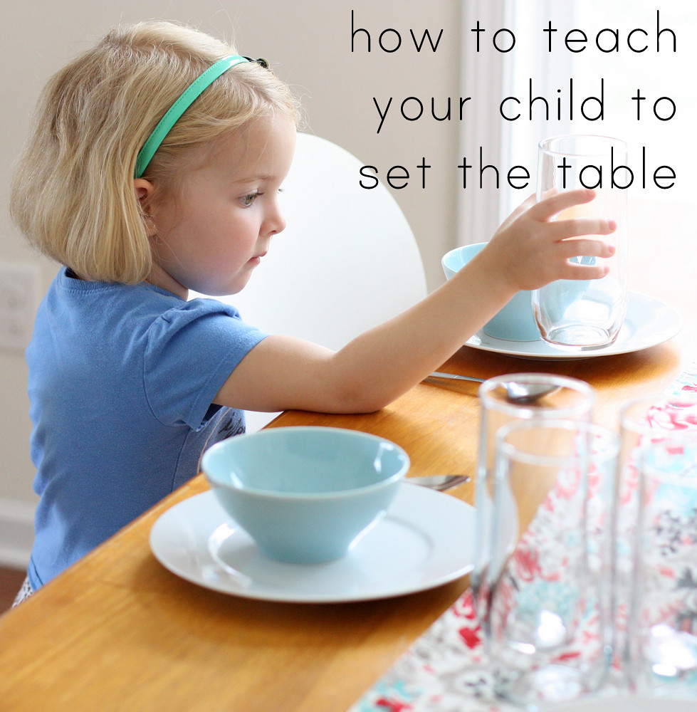 child setting the table