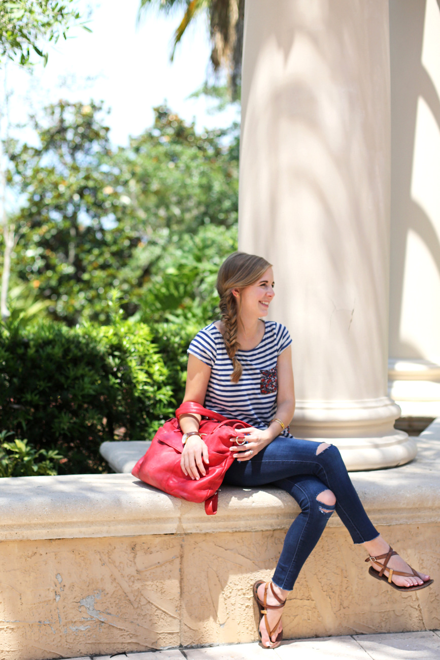 stripes + distressed denim + red bag