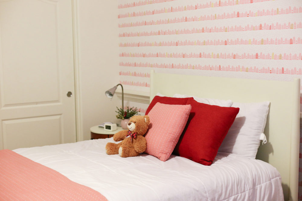 A little girl room with wallpaper from Spoonflower with a modern and fun whimsical pink and gold print that makes a room feel special