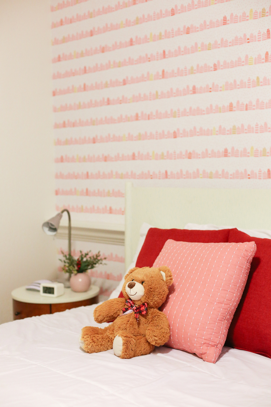 A little girl room with wallpaper from Spoonflower with a modern and fun whimsical pink and gold print that makes a room feel special