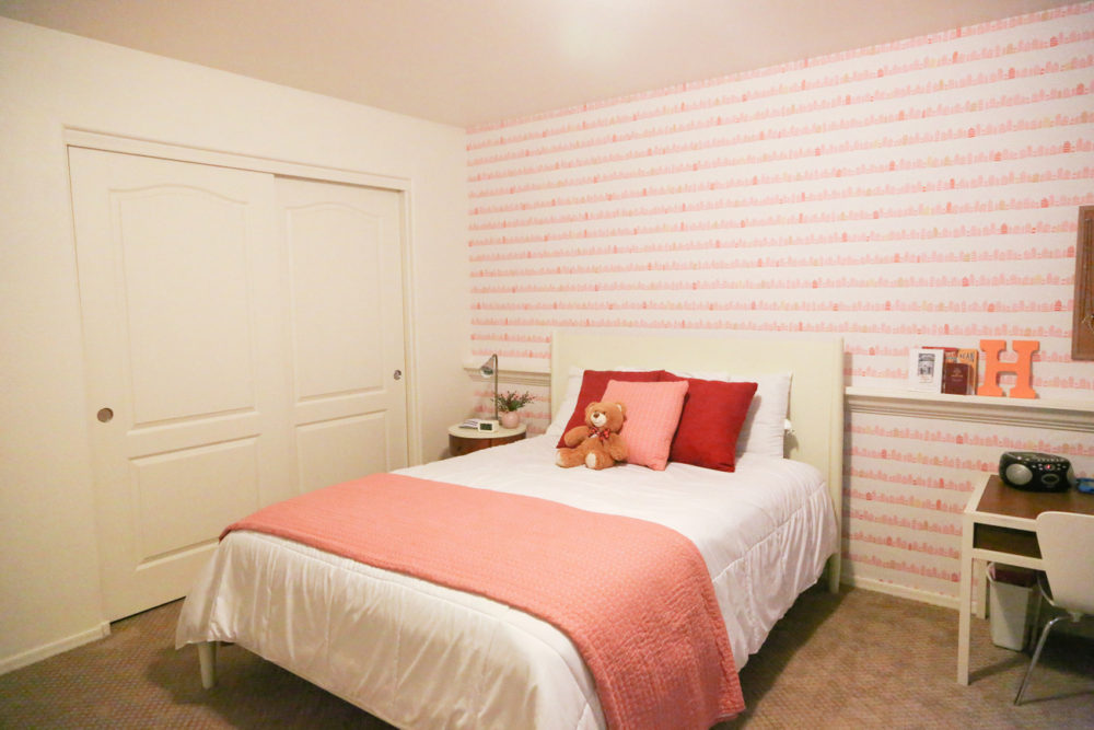 A little girl room with wallpaper from Spoonflower with a modern and fun whimsical pink and gold print that makes a room feel special