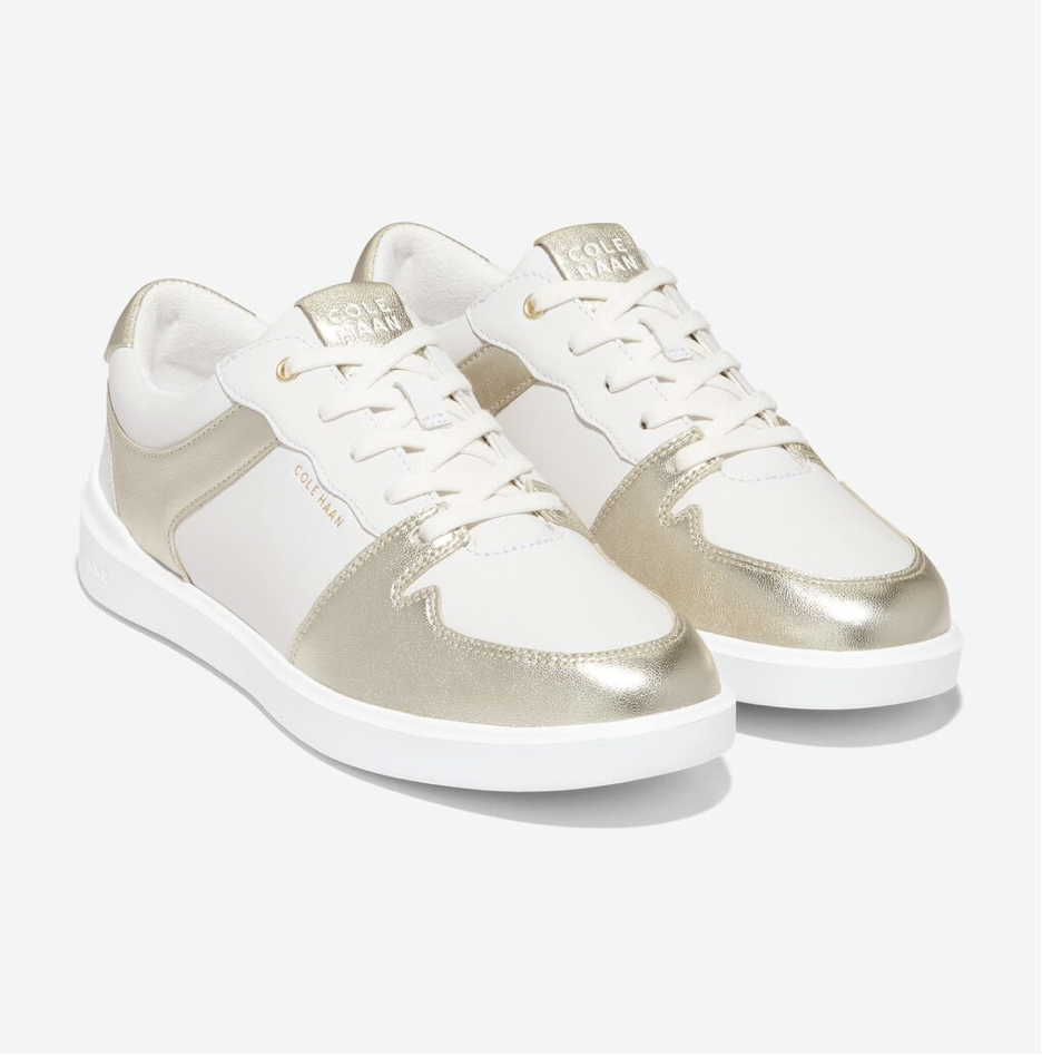 gold and white sneakers