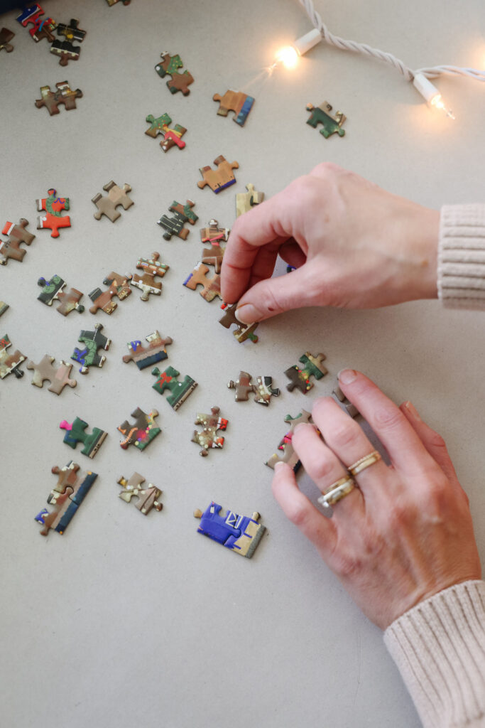 woman putting together a 300 piece puzzle